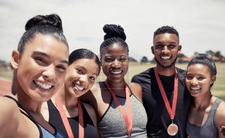 Photo for Women, man and running track team with medals in fitness, workout or training marathon, sprint event or competition race. Portrait, happy smile or winner runners with sports award or exercise prize. - Royalty Free Image