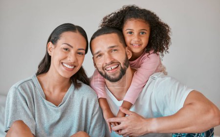 Photo for Family, children and love with a girl, woman and man on a sofa in the living room of their home together. Kids, happy and smile with a mother, father and daughter bonding in a domestic house. - Royalty Free Image