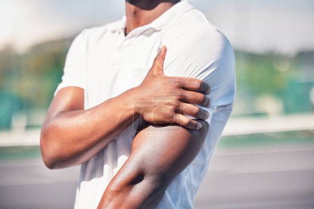 Black man, hand and arm pain from healthcare accident or medical wellness emergency outdoor. African person, shoulder injury and broken bone, hurt muscle or arthritis during fitness workout on court.
