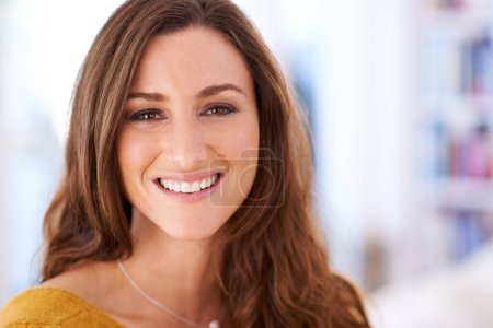 Photo for Her smile makes the day seem brighter. Portrait of an attractive woman indoors - Royalty Free Image