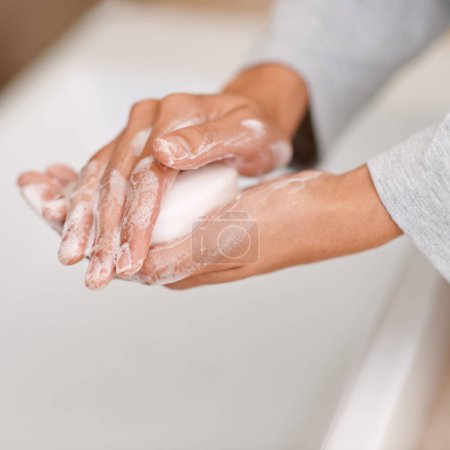 Photo for Shes germ-free now. a woman washing her hands with soap - Royalty Free Image
