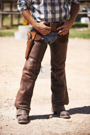 Photo for You dont want to get on his bad side. A cowboy with his hand near his gun - Royalty Free Image