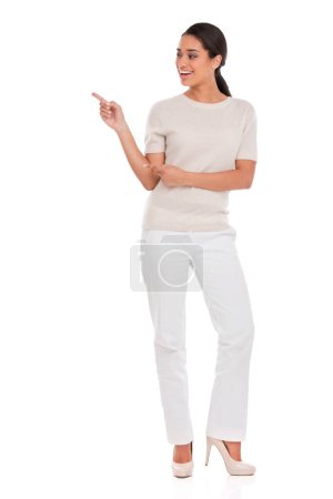 Photo for This product has my full backing. Full-length studio shot of an attractive young woman pointing towards copyspace - Royalty Free Image