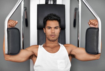 Photo for I make working out look like a breeze. an athletic young man working out - Royalty Free Image
