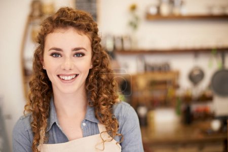 Photo for Expert Barista - put in your requests. Closeup portrait of an attractive young barista standing in a cafe - Royalty Free Image