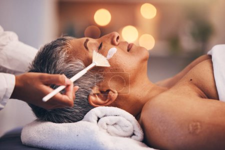 Photo for Spa, facial and senior black woman with mask for skincare, beauty and luxury treatment at beauty salon. Wellness, face massage and mature female relax on holiday, vacation and retirement at resort. - Royalty Free Image