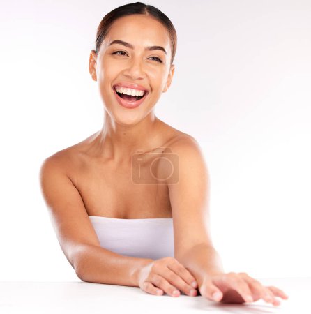 Woman, laughing face or skincare glow with manicure hands, healthcare wellness or dermatology success. Smile, happy or Brazilian beauty model on white background in relax studio with makeup cosmetics.