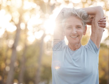 Photo for Fitness, nature and senior woman stretching before an outdoor run or cardio workout with bokeh. Happy, smile and portrait of elderly lady doing warm up exercise before training for a race or marathon. - Royalty Free Image