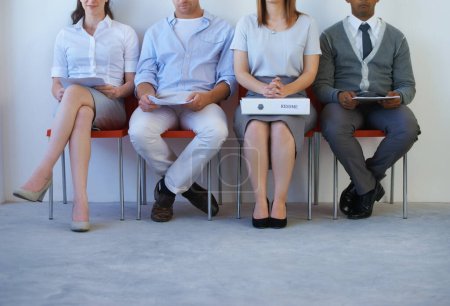 Photo for Maybe the best go forward. four unrecognizable young job applicants sitting in a row - Royalty Free Image