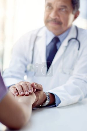 Photo for Leave your health in his capable hands. a doctor holding a patients hand in comfort - Royalty Free Image