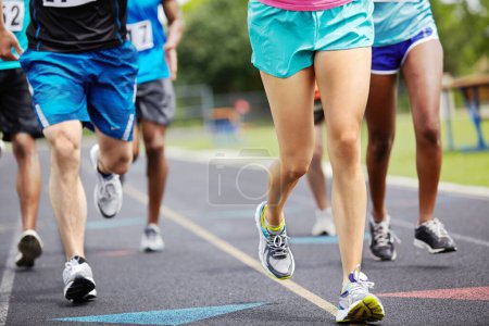 Photo for Running for the winning title. Cropped close up shot of athletes legs during a race - Royalty Free Image