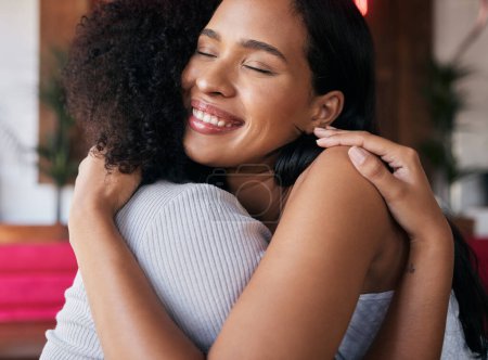 Friends, women and hug with smile, connect and bonding for reunion, happy and support. Young females, girls and embrace for solidarity, love or friendship for greeting, happiness or cheerful to relax.