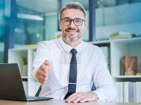 Businessman, handshake and portrait smile for welcome, greeting or introduction at office. Happy senior employee accountant with laptop and hand gesture for shaking hands, deal or agreement.
