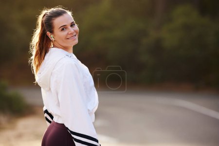 Photo for Woman runner, street and nature for portrait, smile and fitness in summer for health with blurred background. Happy athlete, marathon training and running workout for wellness, self care and exercise. - Royalty Free Image