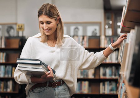 Photo for Woman, books and library to search for choice of author, writer or literature education for reading and learning at college. Happy university student with book for research on a bookstore shelf. - Royalty Free Image