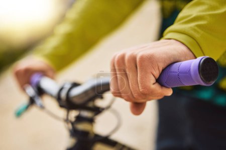 Hands, sports bike and man outdoor getting ready for bmx training, exercise or workout. Cycling, bicycle and male cyclist holding handlebars preparing to ride for adventure, travel or fitness outside.