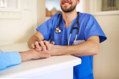 Photo for Im here to help you. an unidentifiable young doctor holding his senior patients hand in support - Royalty Free Image