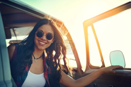 Photo for Full tank and the weather is fine. Its roadtrip time. a young woman enjoying a relaxing roadtrip - Royalty Free Image