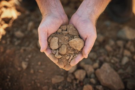 Photo for Beginning from bare ground. a farmer holding soil - Royalty Free Image