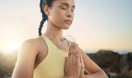 Yoga, hands or woman in meditation at sunrise in nature for calm relaxing peace, wellness or mindfulness. Chakra, gratitude or healthy spiritual girl in zen lotus pose breathing to meditate or focus.