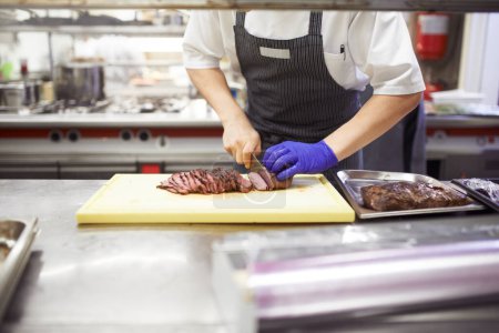 Photo for Cooked to perfection. chefs preparing a meal service in a professional kitchen - Royalty Free Image