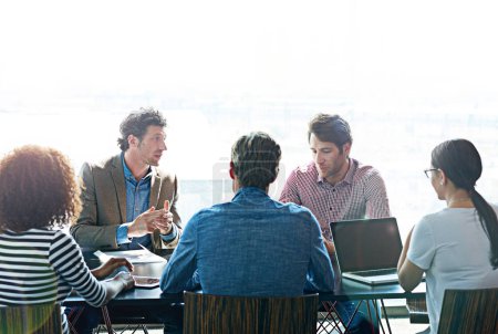 Photo for Everyones ideas are important. a group of coworkers having a brainstorming session in an office boardroom - Royalty Free Image