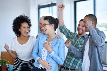 Photo for They did it through teamwork. a excited coworkers cheering in an office - Royalty Free Image