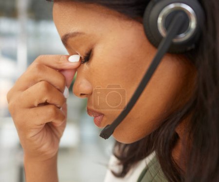 Foto de Headache, stress and call center agent with depression, mental health or anxiety problem in telemarketing, virtual assistant or it support career. Telecom black woman angry, frustrated or sad working. - Imagen libre de derechos