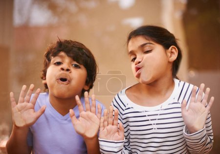 Photo for Goof balls. a cute brother and sister having fun together at home - Royalty Free Image