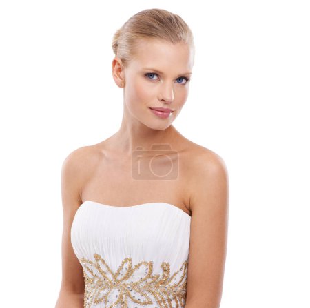 Téléchargez les photos : Eye-catching beauty and glamour. A gorgeous young woman in an evening gown while isolated on white - en image libre de droit