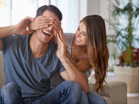 Photo for We spend all our free time together. a young woman covering her husbands eyes for a surprise - Royalty Free Image