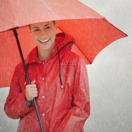 Foto de No weather can bring me down, Im prepared for anything. A beautiful young woman standing outside with her red umbrella - Imagen libre de derechos