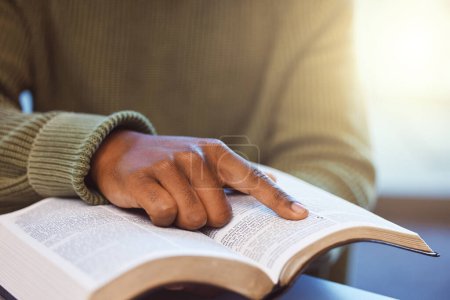 Foto de Hands, black man and reading books for knowledge, library and college education exam. Closeup finger on paper textbook for learning, studying and story for research project, analysis and information. - Imagen libre de derechos