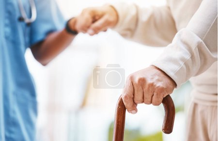 Téléchargez les photos : Walking stick, nurse and hands helping patient, support and therapy of disability, parkinson or arthritis. Cane, disabled old man and physiotherapy in nursing home, elderly healthcare or osteoporosis. - en image libre de droit