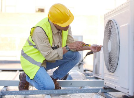 Air conditioning, technician or engineer on roof for maintenance, building or construction of fan hvac repair. Air conditioner, handyman or worker with tools working on a city development project job.