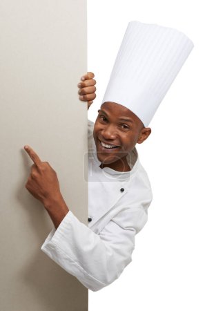 Photo for Advertising his new restaurant. Portrait of an african chef standing behind copyspace - Royalty Free Image