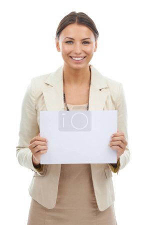 Photo for Get the message. Studio shot of an attractive young businesswoman holding a blank paper isolated on white - Royalty Free Image