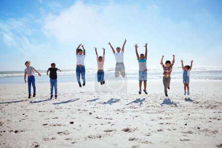 Téléchargez les photos : Big family, beach jump and adventure for holiday, sky and bonding for interracial diversity by waves. Happy family, mom and jumping with hands in air for solidarity, care or love on vacation by sea. - en image libre de droit