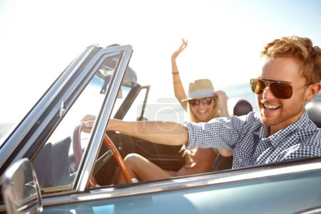 Car road trip, happy travel and couple on bonding holiday adventure, transportation journey or fun summer vacation. Love flare, convertible automobile and driver driving on Canada countryside tour.