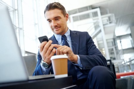 Foto de Businessman with phone, communication and social media, executive in corporate lounge with technology and coffee Contact, man online and email networking and management with b2b and social network. - Imagen libre de derechos