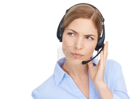 Thinking, customer service and face of woman at call center in studio isolated on white background mock up. Crm, ideas and doubt of female telemarketer, consultant or sales agent listening on headset.