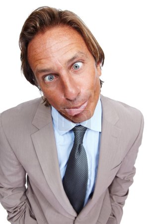 Photo for Funny, comic and portrait of a business man with a silly face and a suit with white background. Crazy, joke and comedy of a model executive isolated with funny face and humor being goofy for work. - Royalty Free Image