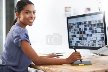 Hard work pays off. a young african american woman working at her computer in the office
