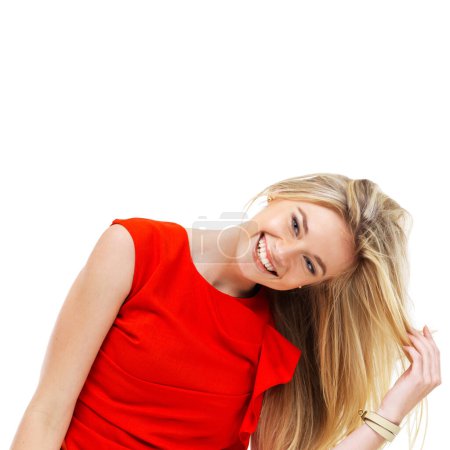 Téléchargez les photos : Letting her hair down. A beautiful young blonde girl in a red dress laughing - en image libre de droit