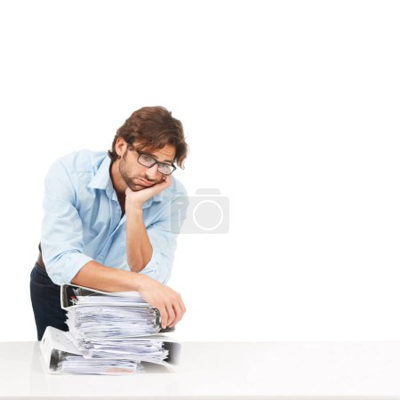 Photo for Stress, burnout and businessman with paper, documents and workload pressure on a white background. Overwhelmed, male and corporate employee with boring admin task looking exhausted, sad and isolated. - Royalty Free Image