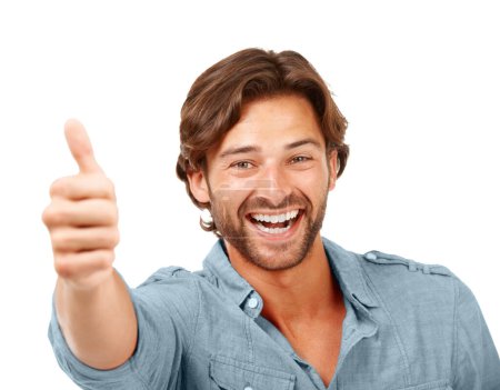 Thumbs up, OK and man with smile, portrait with hand sign, yes and thank you with feedback against white background. Happy man, agreement and success with motivation for winner and vote in portrait.