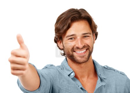 Téléchargez les photos : Thumbs up, OK and man with smile, face with hand sign, yes and thank you with feedback against white background. Happy man, agreement and success with motivation for winner and vote in portrait. - en image libre de droit