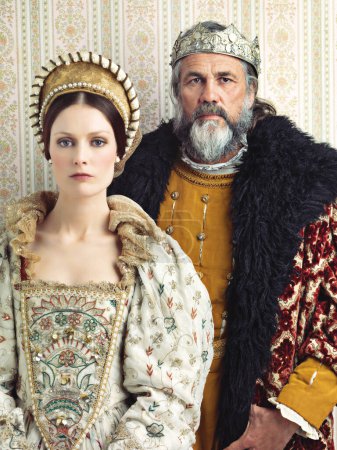 Téléchargez les photos : Medieval portrait of king and queen, isolated on studio background for history, renaissance design or vintage fashion. Headshot, face of royal couple with power, wealth and leader in English culture. - en image libre de droit