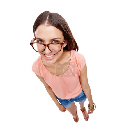 Photo for Woman, happy and portrait of a model with glasses, smile and casual fashion. White background, happiness and isolated young person looking up with eyewear in a studio feeling positive and calm. - Royalty Free Image