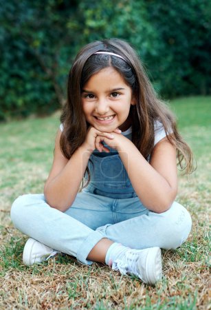 Photo for All my friends are all coming over for a playdate. an adorable little girl sitting outside - Royalty Free Image